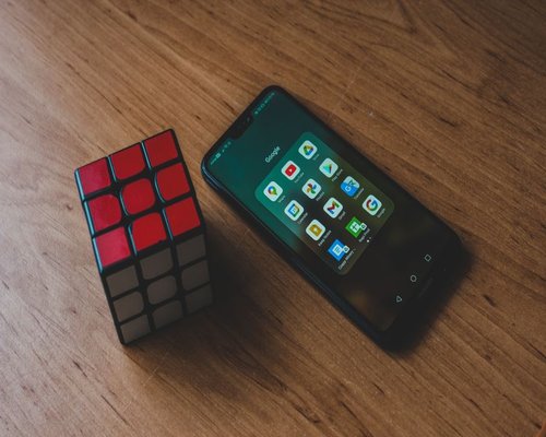 Angled smartphone showing the fictional Coral Logic Sector puzzle game